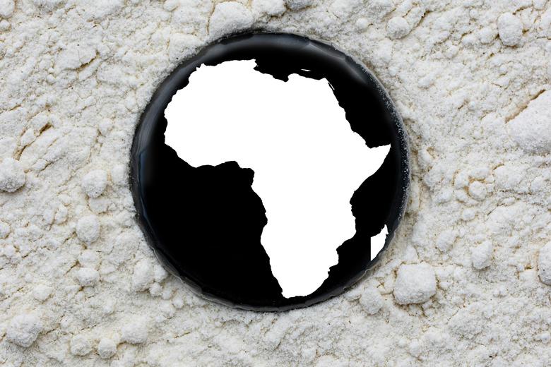 An outline of the African continent on a badge on a textured background