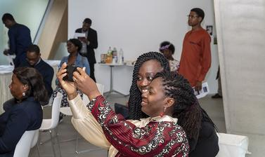 two women take a selfie at the event