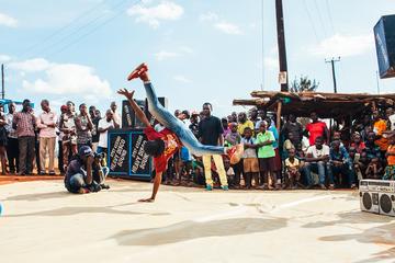 colourful image of a man breakdancing in Uganda