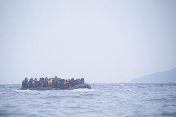 refugees on a boat crossing the mediterranean sea heading from turkish coast to the northeastern greek island of lesbos 29 january