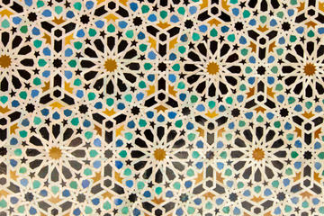 Islamic mosaic art in black, yellow, green and blue