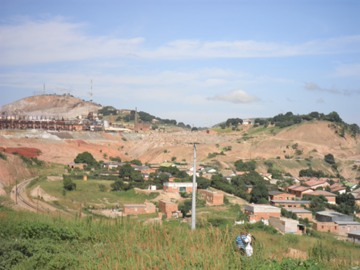 photo of mining town with small hill