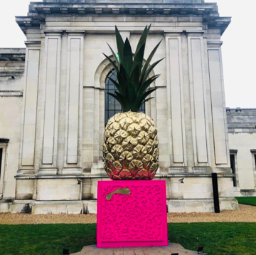Giant painted pineapple on lawn