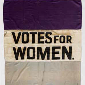 Women's Suffrage flag, purple, white, and grey stripes with the inscrription of 'Votes for Women' on the white stripe.
