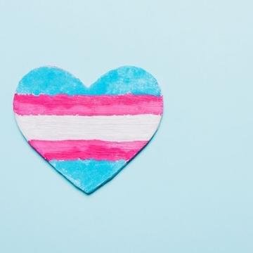 a light blue background with the heart painted with blue, pink and white, then pink and blue lines horizontally 
